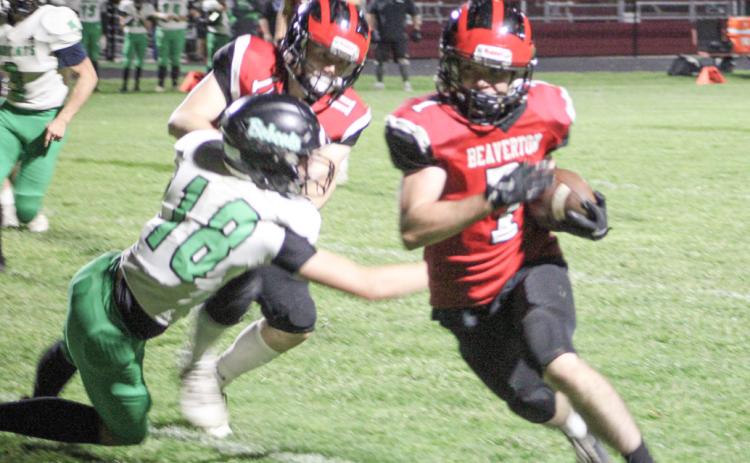 Beaverton’s Karter Offenbecker makes a cut up the field during Friday night’s victory over Houghton Lake.