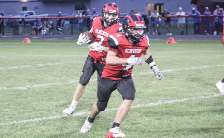 Jack Blades runs behind blocker Ty Wicke during a Beaverton junior varsity game earlier this season.