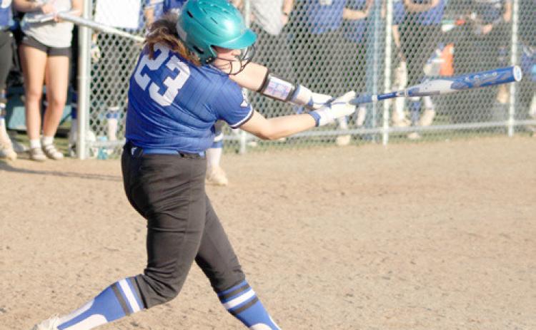 Gladwin’s AvaKay Hilts smacks one during a game earlier this season. The Flying G’s split two doubleheaders last week.