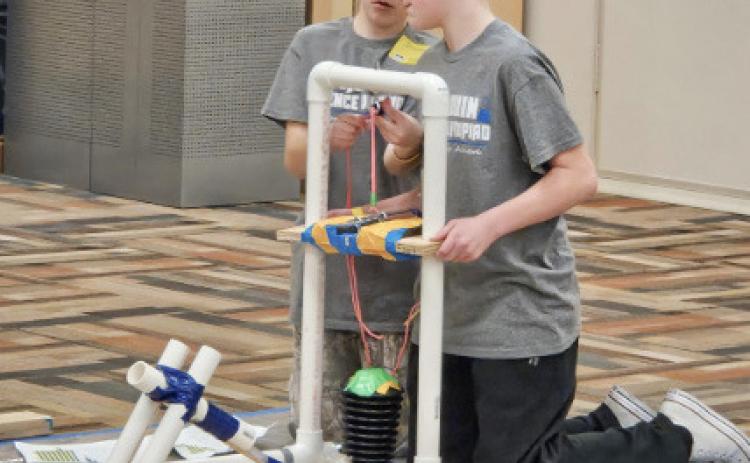 Jericho Barz and Brennan Smith discussing their strategy for hitting the target in Air Trajectory.