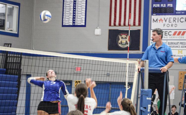 Gladwin’s Ansley Mausolf rises up for the kill during a match earlier this season. The Flying G’s will host Farwell this evening to open JPC action.