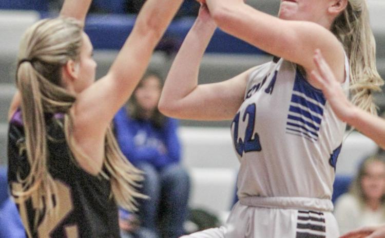 Lizzie Haines goes up with a shot during a game last season. The senior returns to the starting lineup for Gladwin this year.