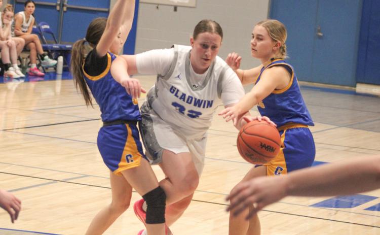 Gladwin’s Lela Gee powers through the defense during last week’s victory over visiting Carson City Crystal.