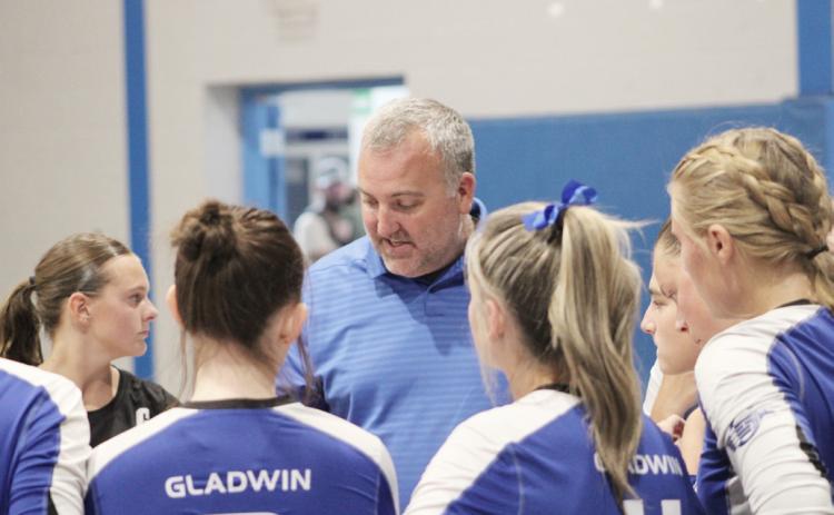 Gladwin coach Tony Wetmore talks strategy with the troops during a break in the action.