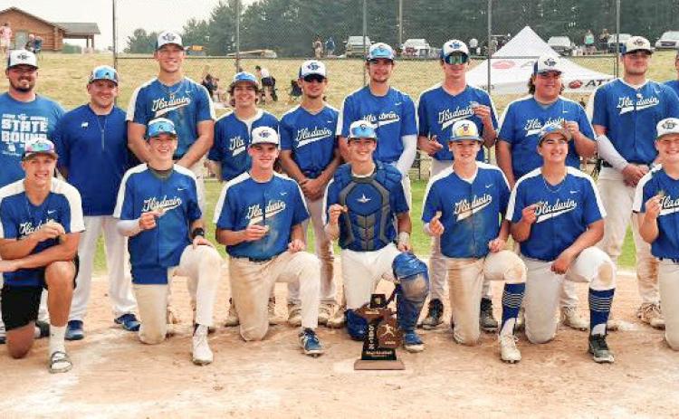 The Gladwin Flying G’s with their 2023 District winning trophy after Saturday’s victory over the Cadillac Vikings.
