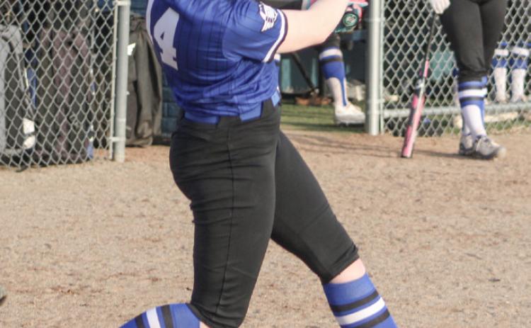 Gladwin’s Elizabeth Mickler takes a cut during Thursday’s season-opening doubleheader against visiting Hemlock.