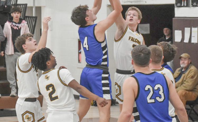 Ben Verellen takes it to the rim during Thursday night’s 64-60 victory at Ogemaw Heights, the 14th win in a row for the Flying G’s. PHOTO BY BETH ORR