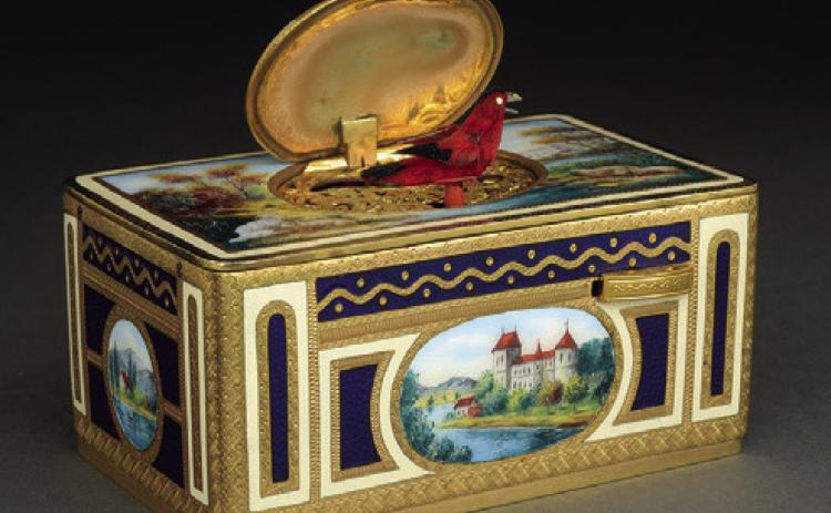 Is it a music box, a toy, a showpiece or a robot? Wind it with a key, and a feathery bird pops out to chirp and flutter in a lifelike way. KOVELS.COM