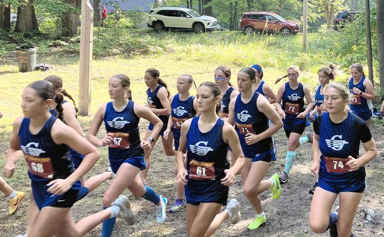 The Gladwin girls’ cross country team takes off at the start of a race last month at the Gladwin Conservation Area. The Flying G’s return to host a Jack Pine Conference jamboree today.