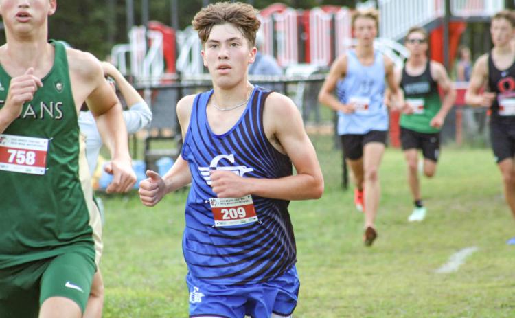 Gladwin’s Ben Verellen chases the leaders during a recent meet. The senior finished second Saturday at Northwood.