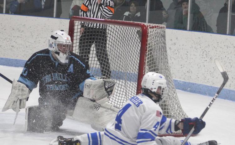 Gladwin’s Ike Wheeler takes a seat after being stopped by the Tri-Valley Thunder’s goalie Friday night.