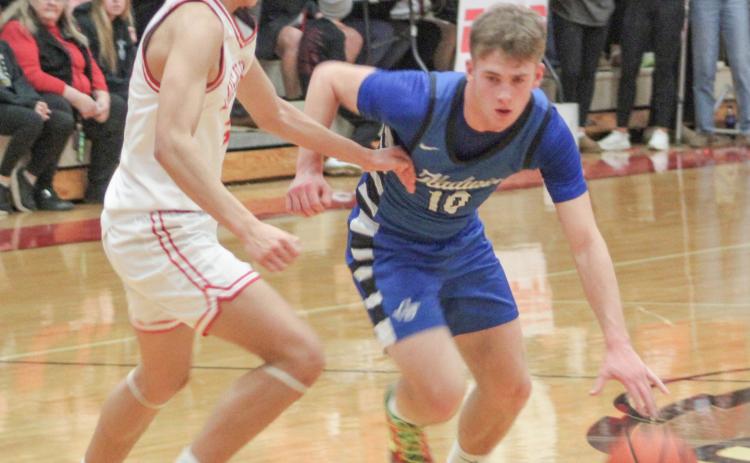 Gladwin’s Jacob Pahl tries to get around Beaverton defender Sean Barta during the Flying G’s victory in the JPC championship game Tuesday night.