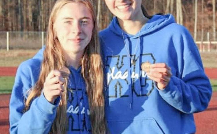 Gladwin’s Lily Binger (left) ran 11th and Abby Robinson was 13th at Friday’s regional, which earned both a trip to the state meet.