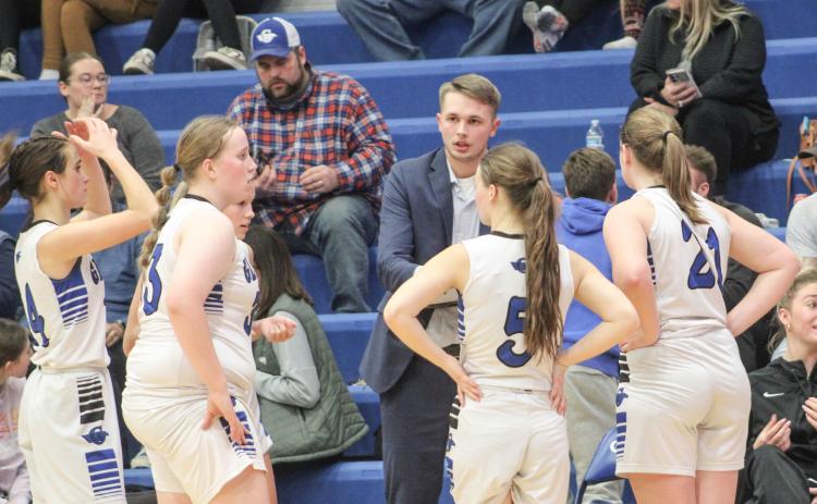 New Gladwin coach Nick Taratuta instructs the troops during a time out in the middle of Thursday’s wild double overtime loss to Shepherd.