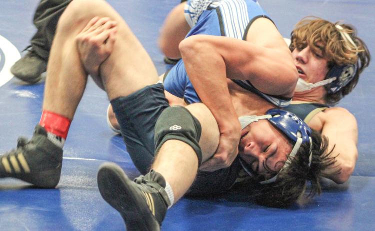 Gladwin’s Cruz Balcirak goes for a pin during a match earlier this year. Balcirak won the Jack Pine Conference championship at 126 Saturday.