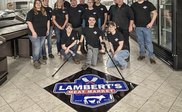 Employees at Lambert’s Meat Market prepare for the soft opening on Wednesday, April 24 and the grand opening at 8 a.m. on Monday April 29.