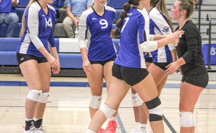 The Gladwin volleyball team had reason to celebrate after winning last Wednesday’s Jack Pine Conference opener over Farwell in three sets.