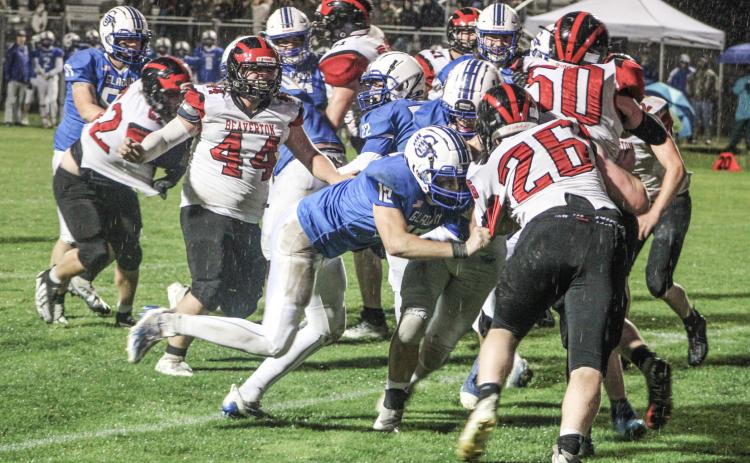 With a wet ball and a rain-soaked field, winning battles like this in the trenches lifted the Gladwin football team to a 50-0 victory over visiting Beaverton Friday night in The Battle For Butch.