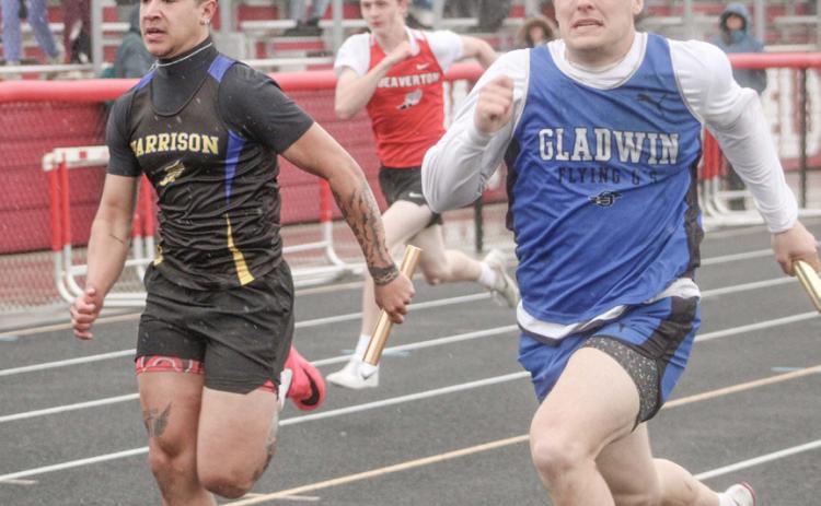 Gladwin’s Colton Pfenninger charges to the finish line at the end of the 400 relay at Wednesday’s meet at Beaverton.