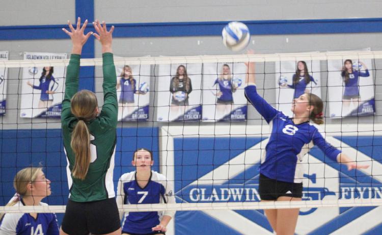 Gladwin’s Maddie Pagel goes up for a kill during last Wednesday’s three-set victory over visiting Clare.