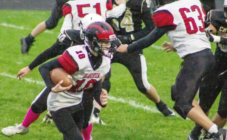 Mitchell Malmo looks for running room during the Beaverton junior varsity football team’s game at Bullock Creek Thursday.