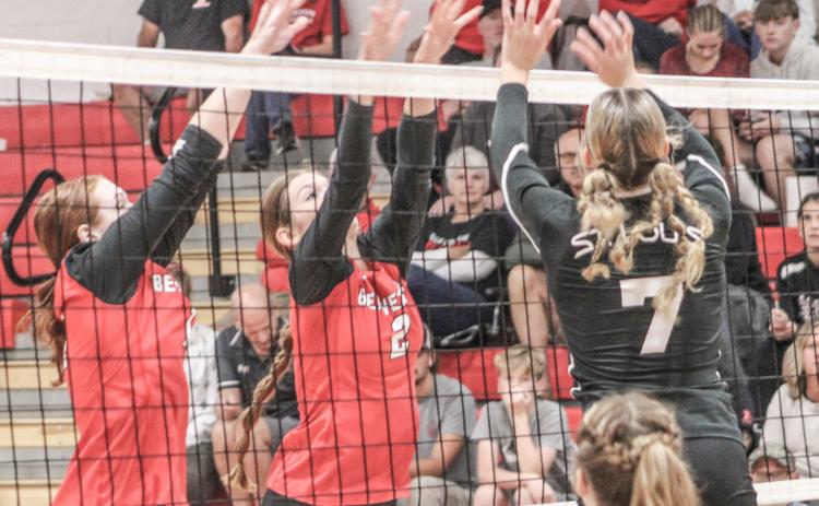 A St. Louis hitter tries to tip the ball out of the reach of the Beaverton blockers Ava Nickel and Bryar Pollard during the Beavers victory last Wednesday night.
