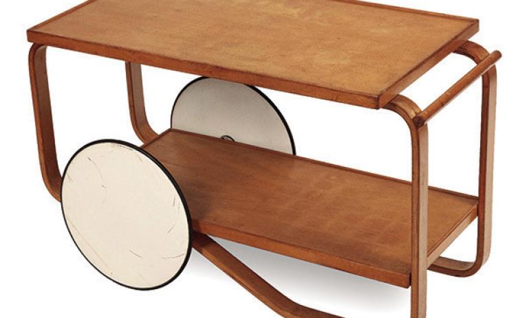 Scandinavian modern design gives an Artek tea trolley a sleek, stylish look. KOVELS.COM