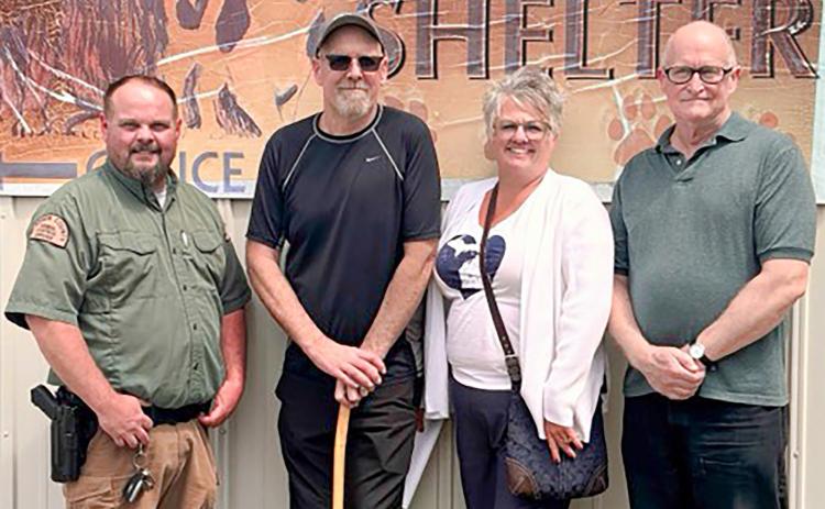 Jim Maveal, Dan Stahl (estate executor), Dana Stahl (niece of Gayla) and Fred Hanchett (son of Gayla) pose together for a check presentation from the estate of Gayla Jacobson to the Gladwin County Animal Shelter.