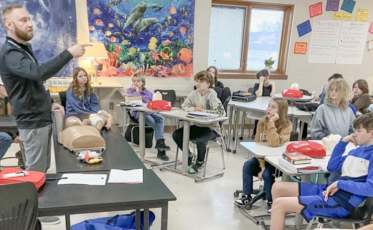 Zach Krahner, a former paramedic and current Community Health Educator for My Michigan Health teaches life saving techniques to Beaverton seventh graders.