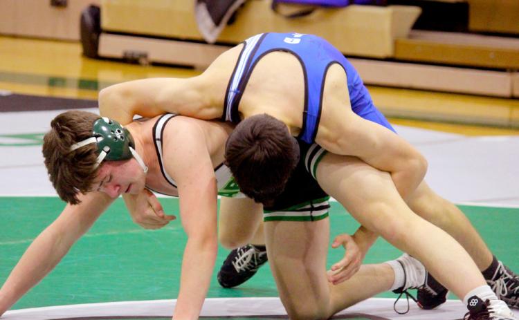 Gladwin looks to wrap up his Clare opponent for the win.