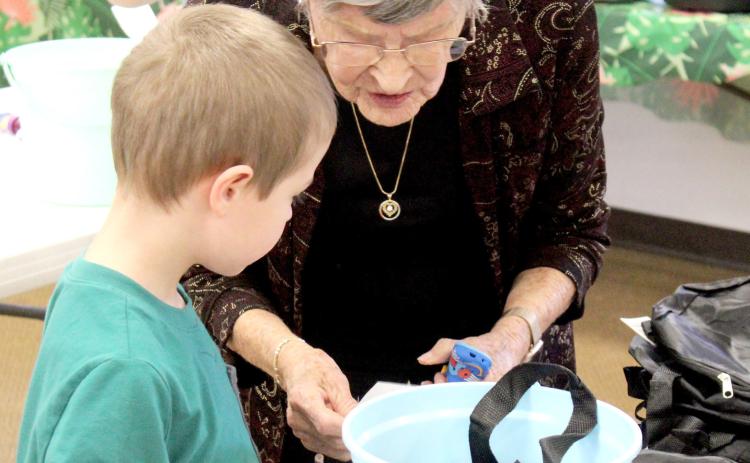 Members of the Christ the King Lutheran Church and the Kidz Club gathered last Tuesday to prepare gift baskets that will be distributed to foster children in Gladwin County.