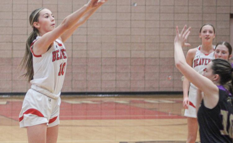 Beaverton’s Harper Pollard launches a 3-pointer that went in off the glass at the buzzer ending the first half of Friday night’s win over Farwell.