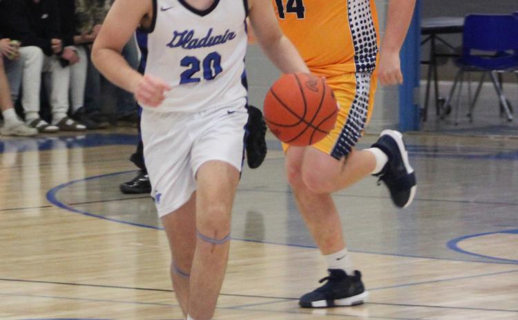 Gladwin’s Brody Verellen races into the front court during last Wednesday night’s victory over Shepherd.