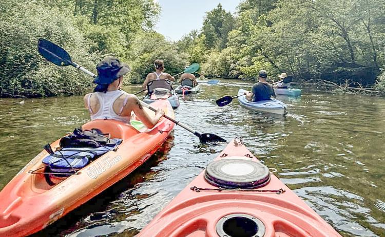 Kayaks and canoes will be paddled toward the finish line during the Race of Two Cities over Memorial Day weekend on the Cedar River.