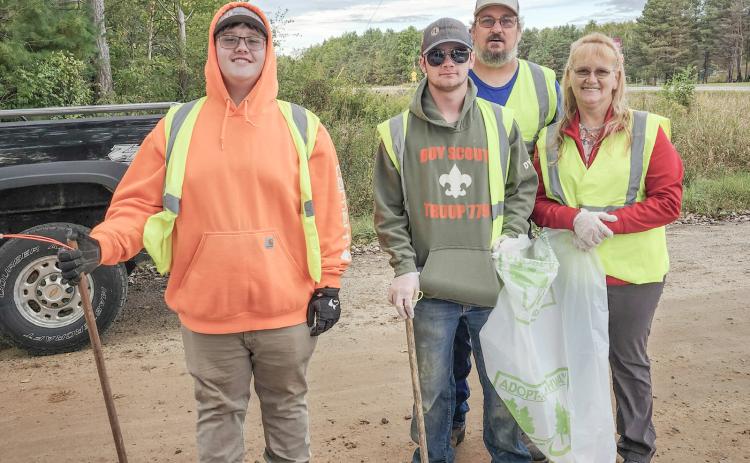 Highway clean up: Riley Banfield, Dylan Moore, Brian Sharpsteen (in back) and Chrissy Sharpsteen.