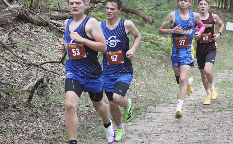 Gladwin’s Nathan Muma and Jeffery Sisson race through the middle of the course on the way to earning medals at the Cedar Bend Invitational Saturday at the Gladwin County Recreation Area.