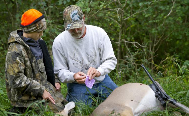 The Michigan Department of Natural Resources reminds hunters across the state that deer harvest reporting is once again required this hunting season.