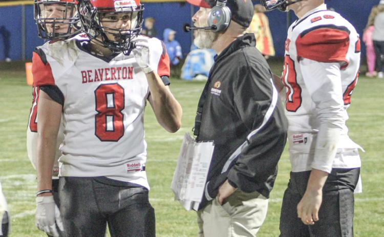 Beaverton coach Aaron Seiser talks things over with his players during a time out. The Beavers will host St. Louis Friday night.