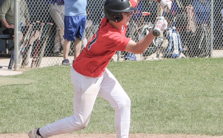 Jackson Fritz of the Gladwin Lightning American Legion Post 171 lays down a bunt during a first-inning rally that led to a 10-0 victory Saturday.