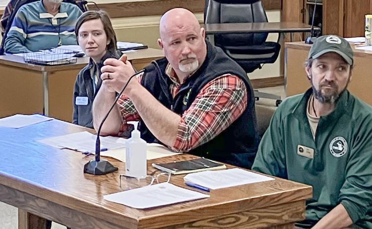 Doug Schultz, at center, of the DNR Fisheries Division is one of several state officials working with Save Trout Lake!