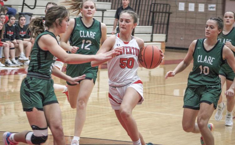 Beaverton’s Myah Hubble fights through the crowd on her way to the basket during last week’s victory over visiting Clare.