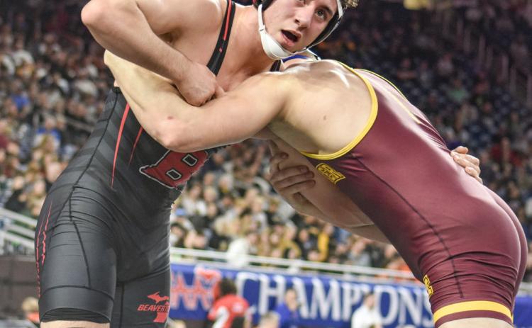 Beaverton’s Eli Roe checks the clock during the Division 4 state championship match at 175 Saturday at Ford Field. PHOTO COURTESY OF HIGH SCHOOL SPORTS SCENE