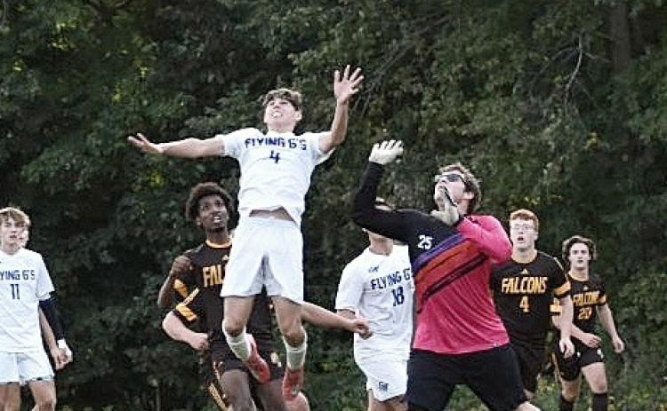 Gladwin’s Sam Townsend gets up to head a ball out of danger during last week’s big 1-0 victory at Ogemaw Heights. BETH ORR