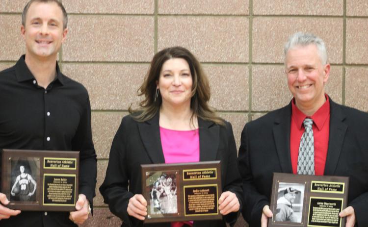 The latest inductees into the Beaverton Hall of Fame (left to right) James Ruhle, Jackie Wheeler and Aaron Wentworth pose with their plaques on Hall of Fame Night at the school’s gym.