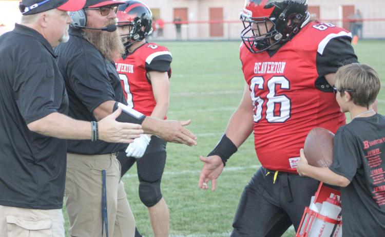 Beaverton’s Leland Love gets a rousing welcome back to the sidelines. The Beavers improved to 2-1 Friday night with a victory over Farwell.
