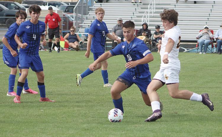 Gladwin’s Barrett Williams cuts off an Ogemaw Heights attacker during last week’s 3-1 loss to the Falcons.