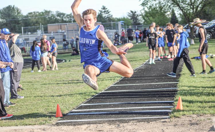 Gladwin’s Drew von Matt soars to a second-place finish in the long jump Friday at the Legends Track Meet.