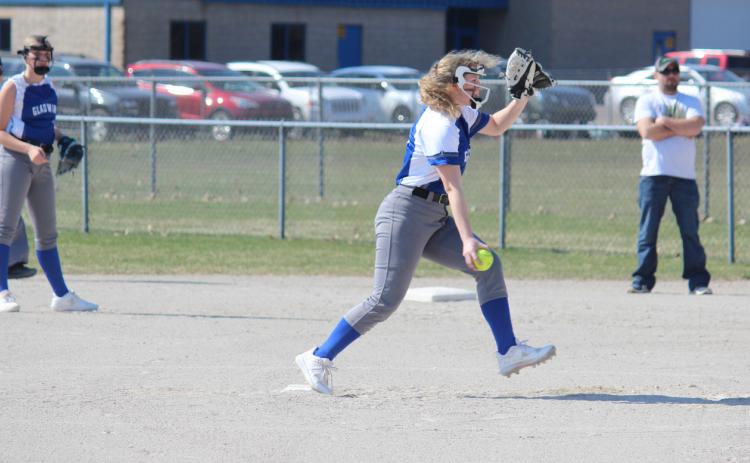 Gladwin pitches the ball to open up the first inning. Inset photo, Gladwin’s shortstop lining up to make the catch.