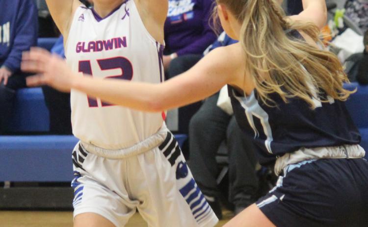 Gladwin’s Anna Seebeck is looking to make a pass during the game against Meridian.