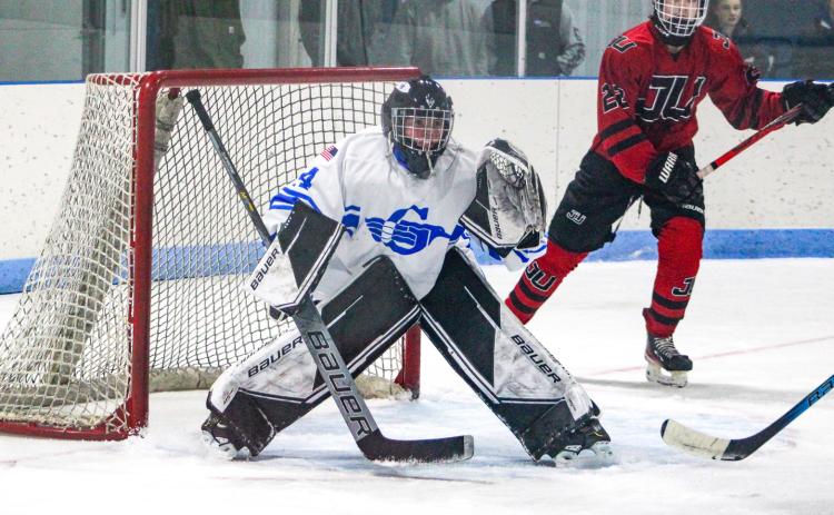 Sophomore goalie Preston Willert guards the cage for his first varsity victory during the Gladwin hockey team’s 4-2 victory over Jackson United Friday night.